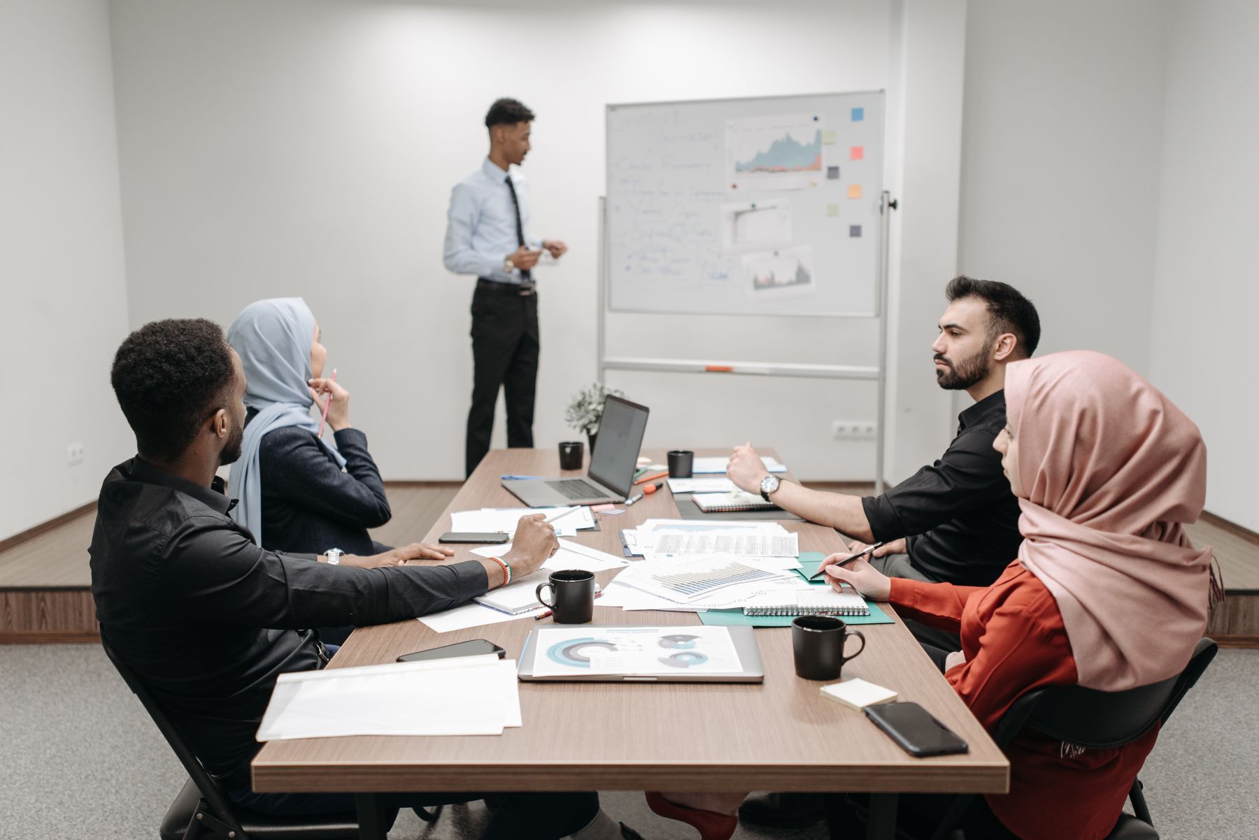 Professional team reviewing information during an office meeting