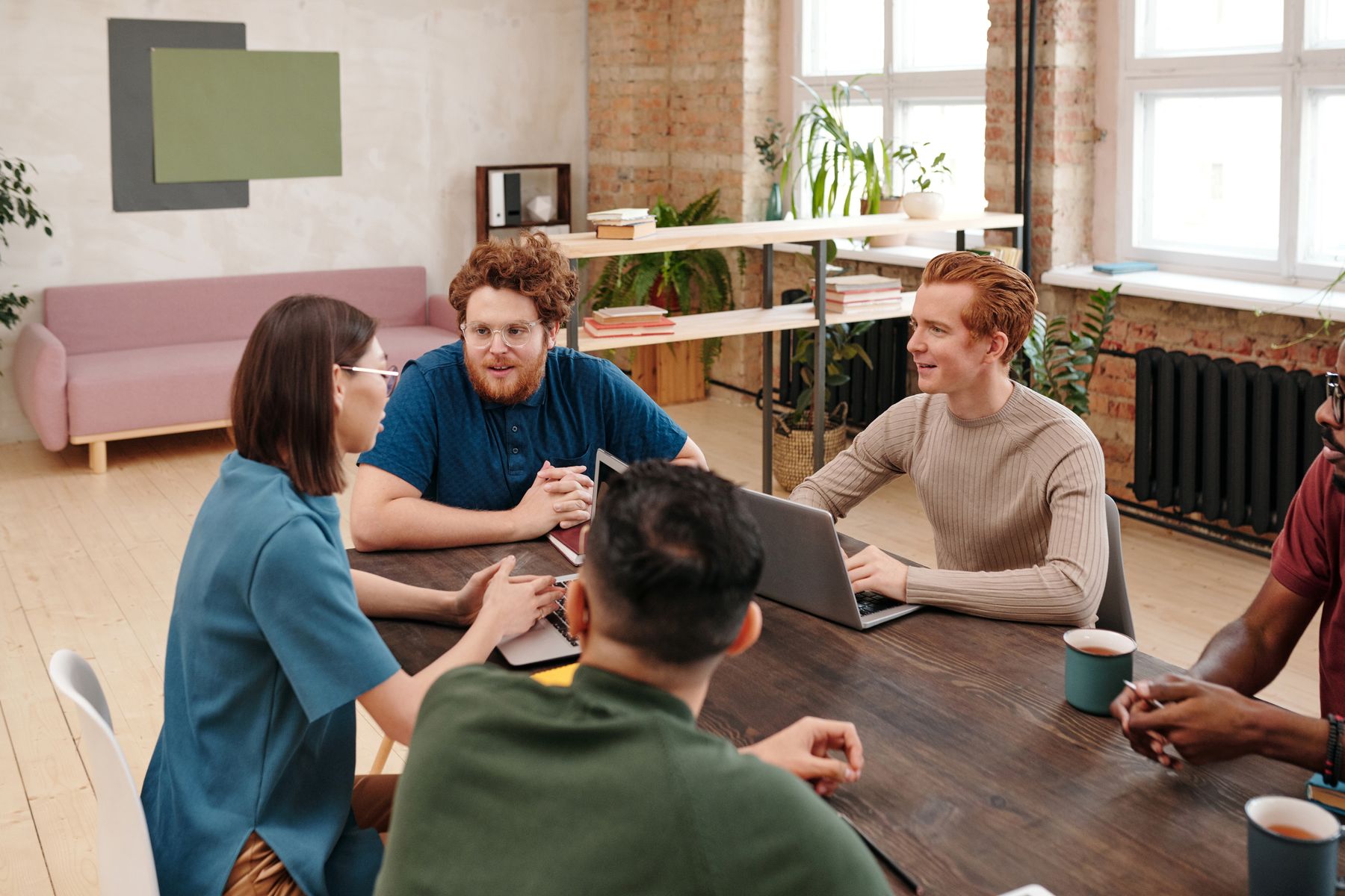 Colleagues having a collaborative meeting in a bright office